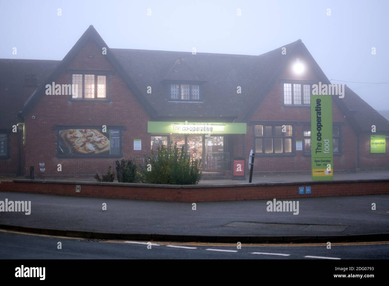 Co-op food store on a foggy winter`s day, Warwick, UK Stock Photo